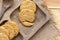 Homemade oat and wholemeal biscuits  on brown wooden tray. Its are a nutrient-rich food associated with protein, fiber and no