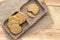 Homemade oat and wholemeal biscuits  on brown wooden tray. Its are a nutrient-rich food associated with protein, fiber and no