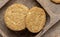 Homemade oat and wholemeal biscuits isolated on brown wooden tray. Its are a nutrient-rich food associated with protein, fiber and