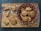 Homemade oatmeal cookies with whole grain rye flour in a plate made from natural vine on a wooden background.Diet healthy food