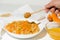 Homemade oatmeal porridge with seasonal autumn pumpkin in a white plate on a light background. autumn composition with wheat ears