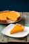 Homemade oldfashioned round pumpkin pie on old table painted blu