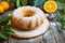 Homemade orange cake on rustic wooden background