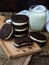Homemade Oreo chocolate cookies with white marshmallow cream and glass of milk on dark background. Selective focus.