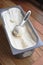Homemade Organic Vanilla ice cream scoop, scooped out of a container