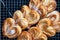 Homemade Palmier Puff Pastry. Delicious french palmier cookies with sugar on a cooling rack. Palmiers, elephant ear, puff pastry