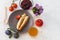 Homemade pancakes filled with cottage cheese on a plate, fruits and a cup of tea