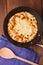 Homemade pancakes on a frying pan with spoon