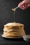 Homemade pancakes with honey and walnuts, vintage white plate, d