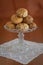 Homemade 'panellets' in vintage glass stand and lace doily.