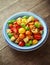 Homemade Panzanella, Tomato traditional Italian salad with red, yellow, orange cherry tomatoes, capers, basil and