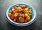 Homemade Panzanella, Tomato traditional Italian salad with red, yellow, orange cherry tomatoes, capers, basil and