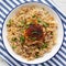 Homemade Paprika Chicken and Rice on a Plate, top view. Flat lay, overhead, from above