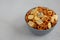 Homemade Party Snack Mix with Crackers and Pretzels in a Bowl, side view. Copy space