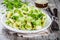 Homemade pasta orecchiette with broccoli, Parmesan cheese and basil
