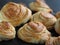 Homemade pastries buns rich on the kitchen dark cutting board, holiday and everyday food