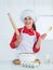 homemade pastry. happy childhood. happy teen girl cooking dough. kid in chef uniform.