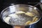 Homemade perogies varenyky boiling in a pot