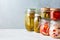 Homemade pickled and fermented vegetables in glass jars, copy space. Home preservation concept