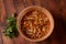 Homemade pickled honey agarics mushrooms with onion slices in wooden bowl.