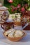 Homemade pierogi in clay ethnic Ukrainian dishes on a table in the summer garden