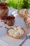 Homemade pierogi in clay ethnic Ukrainian dishes on a table in the summer garden