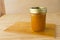 Homemade pine mango jam on wood background