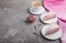 Homemade pink cheesecake with cup of coffee on a gray concrete background. side view, copy space