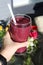 Homemade Pink / Purple Berry and Vegetable Smoothie with Flowers in the Background