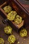 Homemade pistachio candies on wooden background