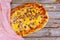Homemade pizza with mushroom on wooden background. Top view