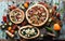 Homemade pizza party. Flatlay of puffy rustic pizzas with pancetta, aubergines, tomatoes, spinach, eggs, bell peppers and arugula