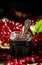 Homemade pomegranate jam in a glass jar with a spoon, fresh open