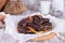 Homemade poppy seed pie. Yeast round closed cake on a wooden table with a linen tablecloth