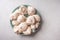 Homemade popular dessert meringue on a green plate on a white wood table