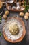 Homemade potatoes dough in wooden bowl with flour and eggs on dark kitchen table background. Top view. Gnocchi preparation. tasty