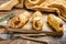 Homemade Pretzel Wrapped Hot Dog, sausage in the dough. wooden background. Top view