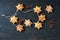 Homemade puff pastry in the form of a star on a string on a blue wooden background with berries.