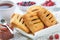 Homemade puff pastry pies with raspberries and blueberries