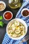 Homemade ready dumplings on a gray concrete table.