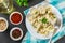 Homemade ready dumplings on a gray concrete table.