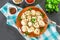 Homemade ready dumplings on a gray concrete table.