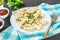 Homemade ready dumplings on a gray concrete table.