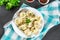 Homemade ready dumplings on a gray concrete table.