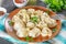 Homemade ready dumplings on a gray concrete table.