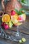 Homemade refreshing fruit sangria or punch with champagne, strawberries, oranges and grapes