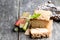 Homemade rhubarb cake topped with sweetened oats on wooden tabl