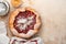 Homemade rhubarb galette made with star pattern on old concrete table background. Process of baking. Open pie. Christmas and New