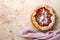 Homemade rhubarb galette made with star pattern on old concrete table background. Process of baking. Open pie. Christmas and New