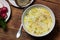 Homemade rice soup on a wooden table. Nutritious lunch.